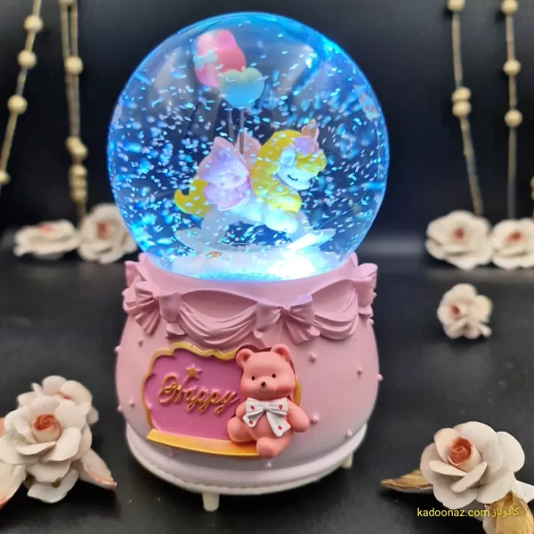 گوی شیشه ای بزرگ موزیکال پمپی برفی با شش طیف نوری طرح اسب تک شاخ Happy رنگ صورتی